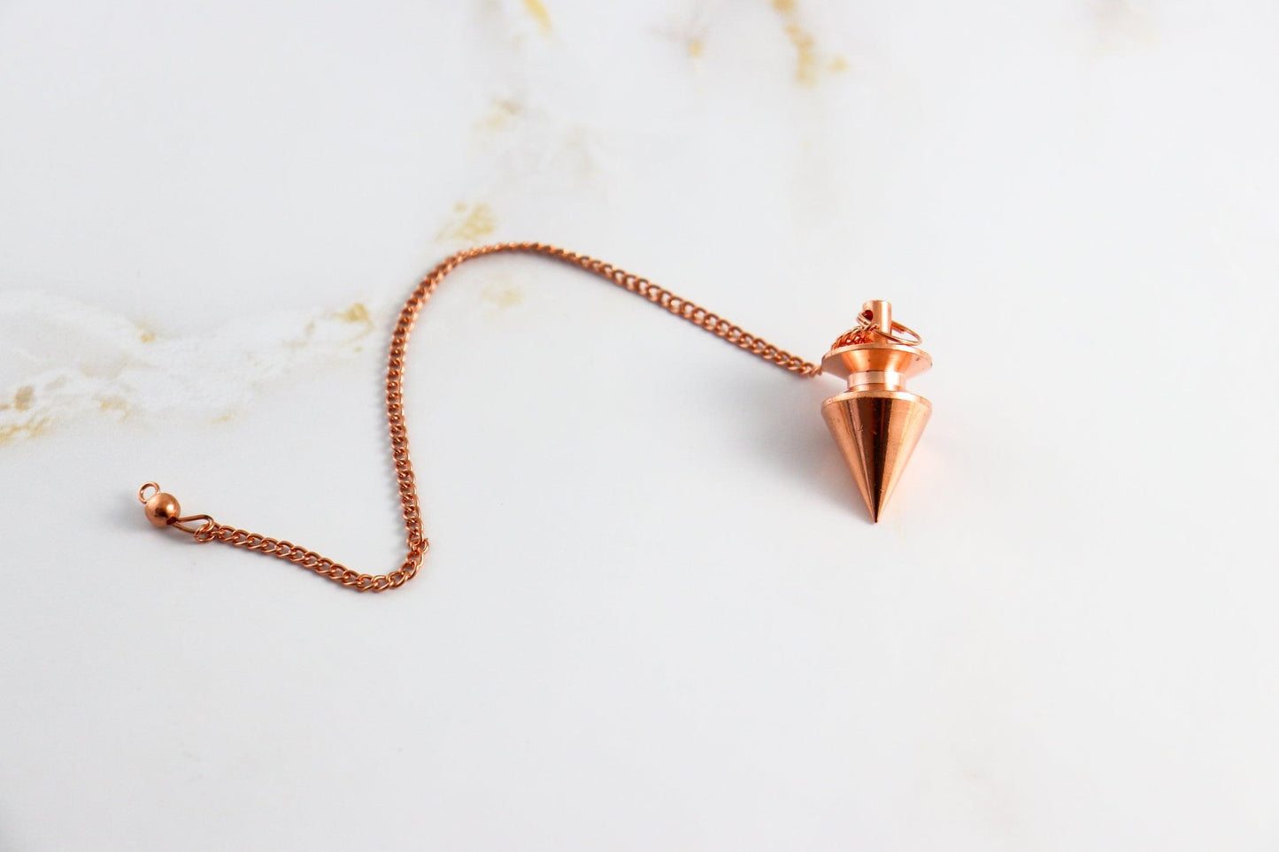 Pendule Triangle - Laiton cuivré